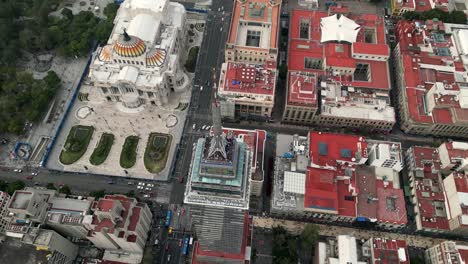 Drone-flight-over-the-Mexico-City-historic-center,-latinoamericana-tower-viewpoint-and-Palacio-de-Bellas-Artes