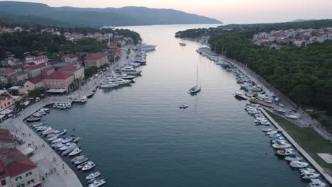 Croatia-Aerial:-Stari-Grad-harbor,-Hvar,-with-moored-boats-and-serene-waters,-at-dusk