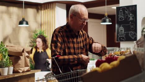Elderly-man-buys-food-in-reusable-jars
