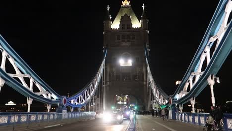 Night-City-Traffic-on-London-Tower-bridge-with-red-double-decker-bus-and-pedestrian-People