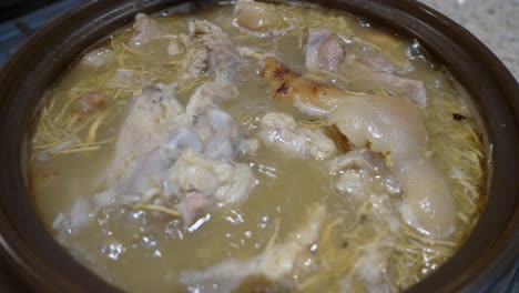slow-cooking-ginseng-pork-bone-soup-boiling-in-clay-pot-zoom