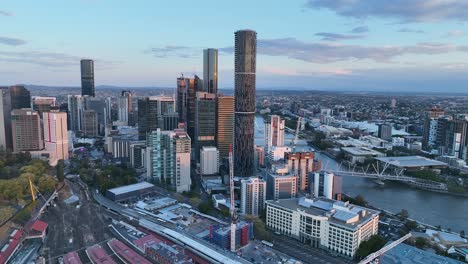 Drone-shot-of-Brisbane-City,-with-Roma-St-Railway-Station-in-foreground-below