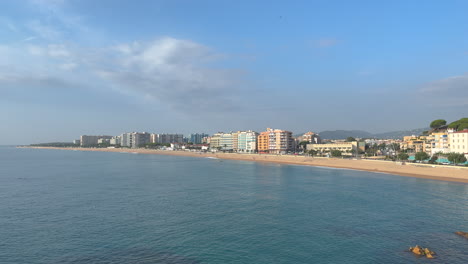 Images-of-the-city-of-Blanes-on-the-Costa-Brava-of-Girona,-Los-Pinos-Beach-main-panoramic-shot-blue-sky-copy-space