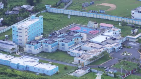 Aerial-shot-of-Najayo-Prison-with-old-buildings-and-blocks-in-San-Cristobal,-Dominican-Republic