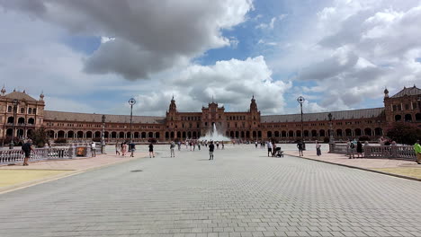 Embark-on-a-captivating-virtual-tour-of-Plaza-de-España-during-the-day,-where-the-sun-casts-a-warm-glow-over-the-bustling-scene