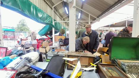 POV-looking-around-British-flea-market-at-variety-of-disposable-unwanted-objects-for-a-cheap-saving