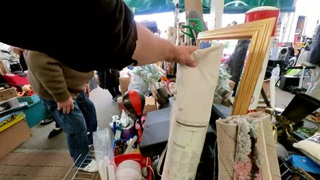 POV-looking-around-British-flea-market-at-variety-of-disposable-unwanted-products-for-a-cheap-bargain