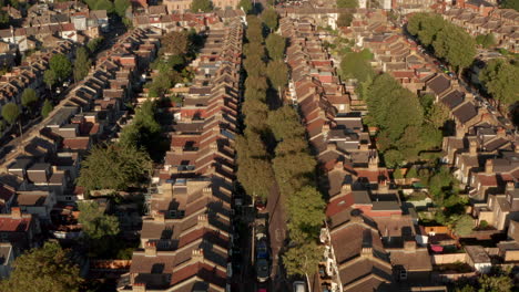 Pan-up-aerial-shot-from-suburban-row-houses-towards-Walthamstow-town-centre
