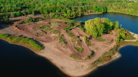 orbiding-aerial-above-large-dirt-bike-tracks-on-island