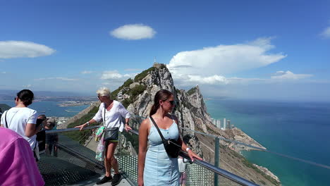 Tourists-Stands-at-Cable-Car-Top-Station-with-Scenic-Views-Over-Rock-of-Gibraltar