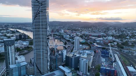 Aerial-shot-flying-above-Brisbane-CBD,-camera-pushing-past-Brisbane-Skyscraper-the-Meriton-Building