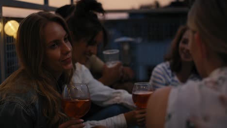 28-Caucasian-girls-talking-together-at-evening-party-in-top-of-the-roof.
