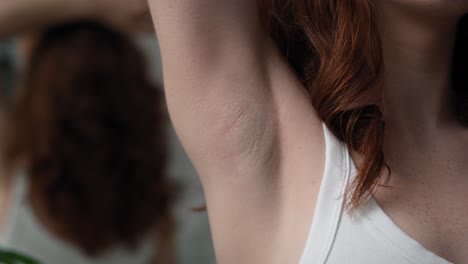 Close-up-of-woman-with-applying-antiperspirant.