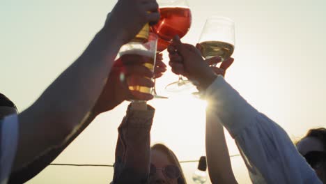 Group-of-friends-make-a-toast-at-sunset-in-the-city.