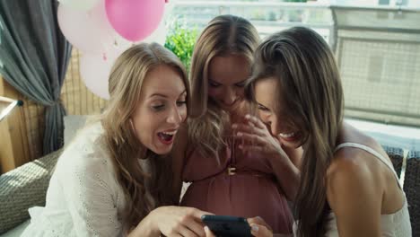 Group-of-adult-women-make-a-selfies-at-baby-shower.
