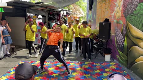 Young-artist-dancing-hip-hop-in-Comuna-13-street,-Medellin