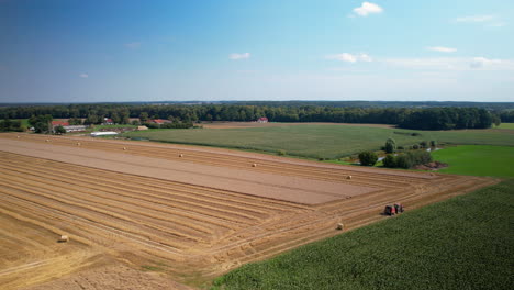 Aerial-view-of-tractor-toiling-for-harvest-in-agriculture-farm-land