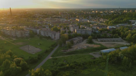 Cinematic-aerial-view-of-Daugavpils-city-in-Latvia-under-sunset-sky