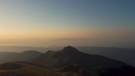 Aerial-silhouette-of-beautiful-mountain-peak-at-sunrise
