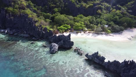 Aerial-Location-reveal-of-Star-Beach-on-Tapiutan-island-of-El-Nido,-Philippines