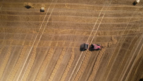 Aerial-view-of-tractor-harvesting-on-agricultural-land-for-food-production