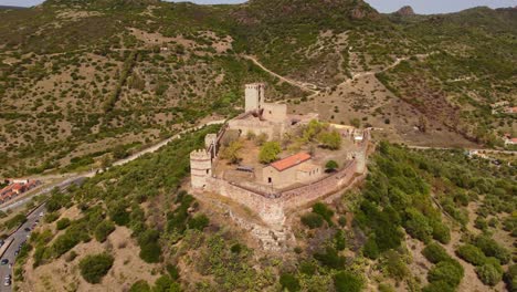 Bosa-majestic-aerial-view-of-Castle-of-Serravalle,-circle-pan,-Sardinia,-day