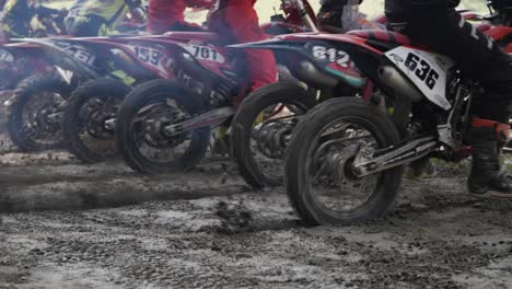 Slow-motion-start-of-dirtbike-motocross-race-during-competition