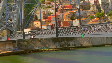 Pan-shot-of-the-Dom-Luis-I-Bridge,-lower-part-in-the-city-of-Porto,-Portugal