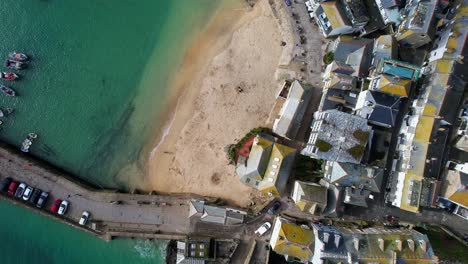 Aerial-Drone-View-Overlooking-St-Ives-in-Cornwall-with-a-Top-Down-Shot-Over-the-Harbor-and-Houses,-England,-UK