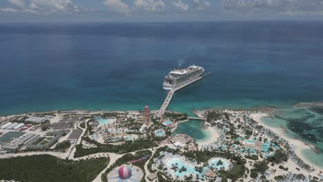 Aerial-flyover-of-Bahamas-islet-waterpark-toward-Caribbean-cruise-ship