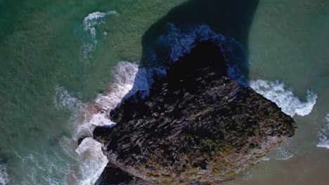 Aerial-Top-Down-Cornish-Coastline-with-Rocky-Island-and-Surrounding-Waves