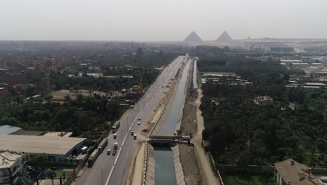Aerial-Shot-for-The-Pyramids-of-Egypt-in-Giza-beside-the-River-Nile-beside