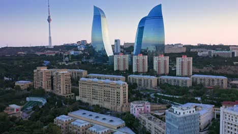 Aerial-view-of-modern-glass-skyscrapers-at-sunset-dawn-in-Baku,-Azerbaijan
