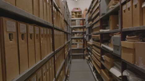 Focus-rack-of-long-aisle-of-archive-with-a-lot-of-files