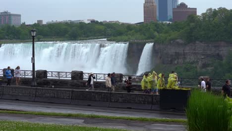 Group-Of-Tourists-Wearing-Ponchos-At-Niagara-Falls,-Canadian-Attraction