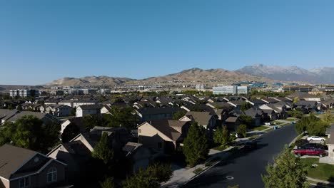 Suburb-and-business-offices-on-the-foothills-in-Lehi,-Utah---push-in-aerial-flyover