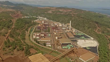 An-aerial-drone-shot-of-a-subsidiary-of-Sumitomo-corp-mining-factory-plant-at-Taganito-Claver,-Philippines