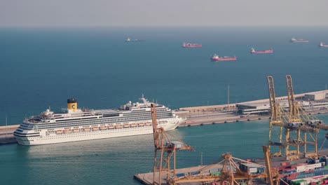 Stunning-Footage-of-Costa-Concordia-Cruise-Ship:-Majestically-Anchored-Near-Barcelona's-Bustling-Cargo-Harbour