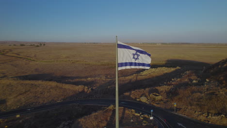 Close-up-on-The-Israeli-flags-as-a-memorial-to-IDF-soldiers-who-were-killed-in-the-war-against-Syria,-they-are-in-the-Golan-Heights-on-the-Tel-Saki-bunker-that-was-used-in-the-war