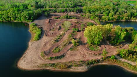 amazing-aerial-off-road-dirt-bike-motocross-tracks-next-to-a-lake-and-forest