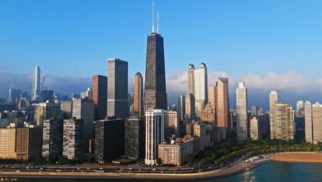 Aerial-hyperlapse-around-the-sunlit-Streeterville-skyline,-golden-hour-in-Chicago
