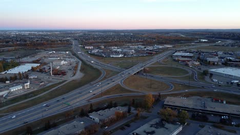 A-circular-drone-shot-of-a-busy-highway-within-the-city-limits-of-Calgary