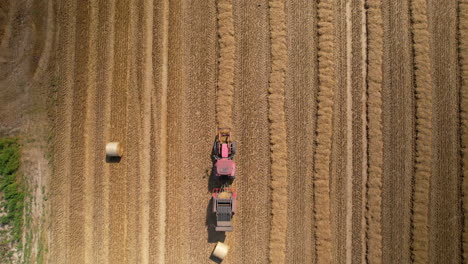 Top-down-drone-shot-of-Tractor-working-on-field