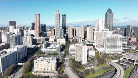 Drone-shot-revealing-Georgia-skyscrapers,-Hotel-District-skyline-buildings,-Downtown-Atlanta,-USA
