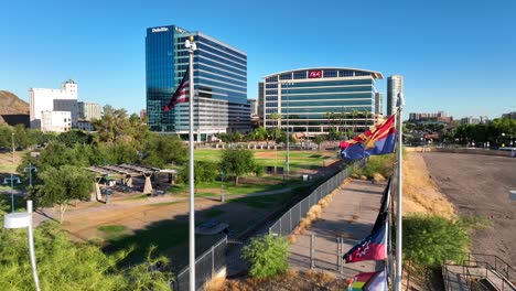 American-flag-and-Arizona-flags-waving-in-park-in-downtown-Tempe,-AZ