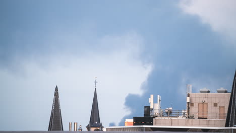 Smoke-blows-over-the-cross-on-a-steeple