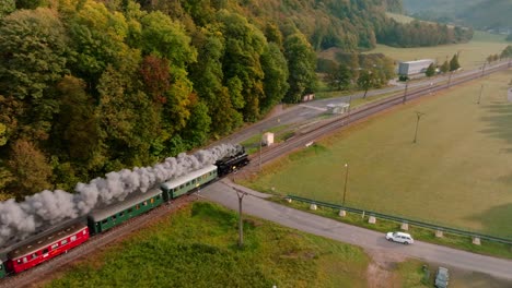 Majestic-Steam-train-makes-it-way-through-the-Czech-Republic,-aerial