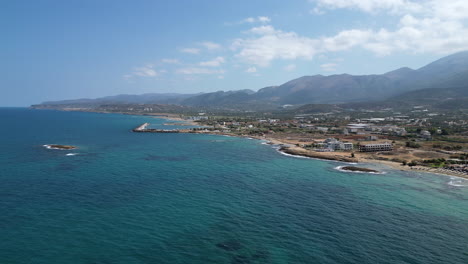 Aerial:-Beautiful-Coastline-And-Turquoise-Water-Of-Malia,-Crete