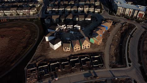A-drone-shot-of-houses-under-construction-in-Yorkville,-Calgary,-Canada