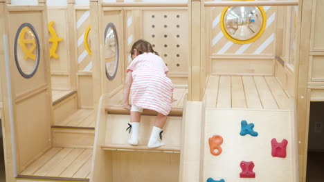 Active-Little-Girl-Climbs-Up-and-Moves-Though-in-Playroom-Obstacle-Course-in-Playroom